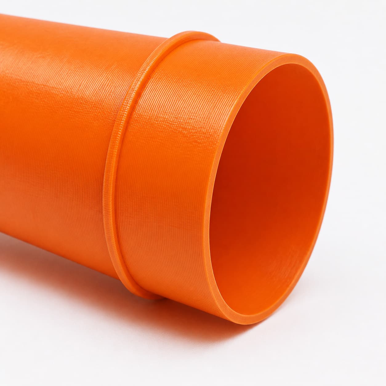 A close view of the dust adapter opening, about 127 mm across