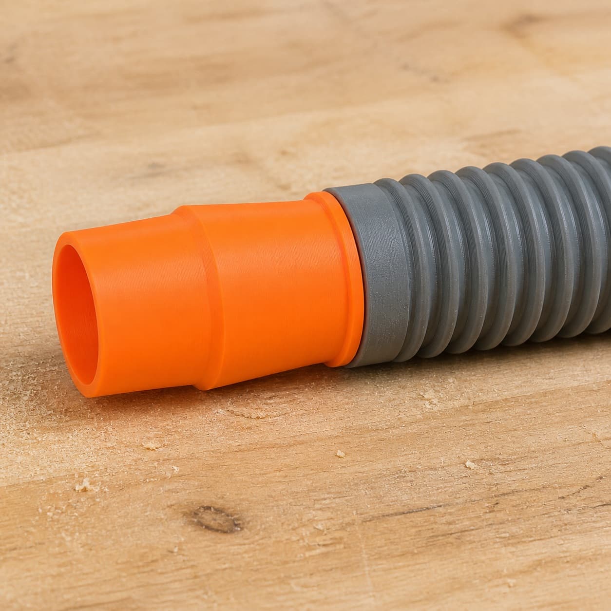 The CMXEMAX69434501 dust adapter connected to a plain shop vac hose
