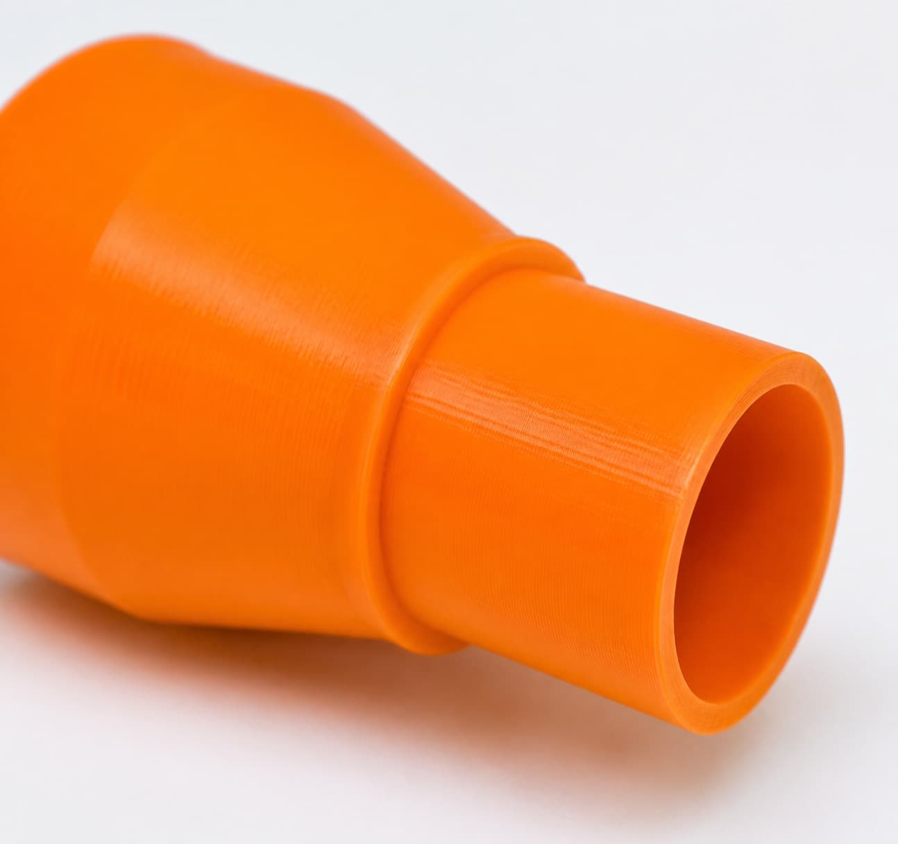 A close view of the dust adapter opening, about 31.75 mm across