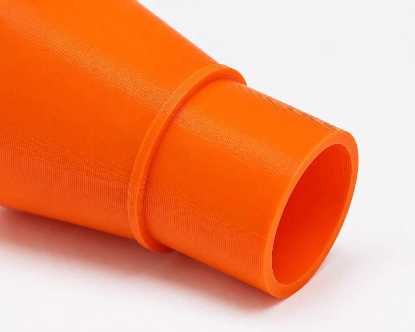 A close view of the dust adapter opening, about 36 mm across