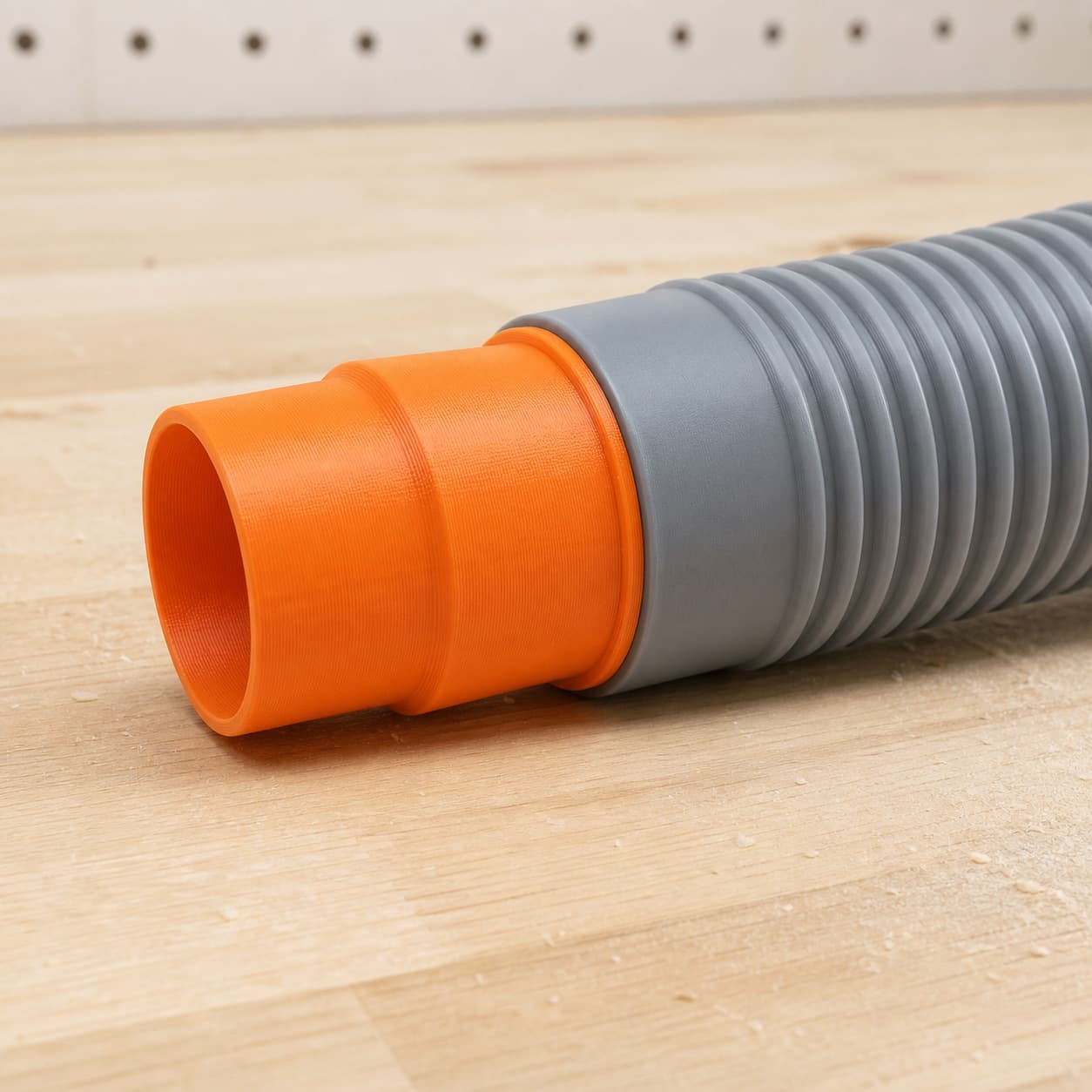 The CMXETAX dust adapter connected to a plain shop vac hose